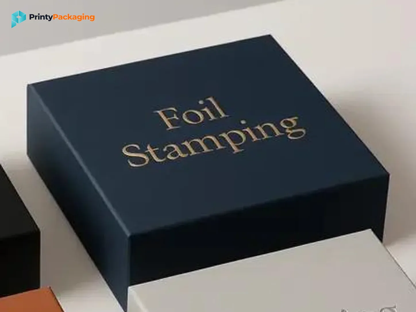 Navy box with gold foil stamped lettering