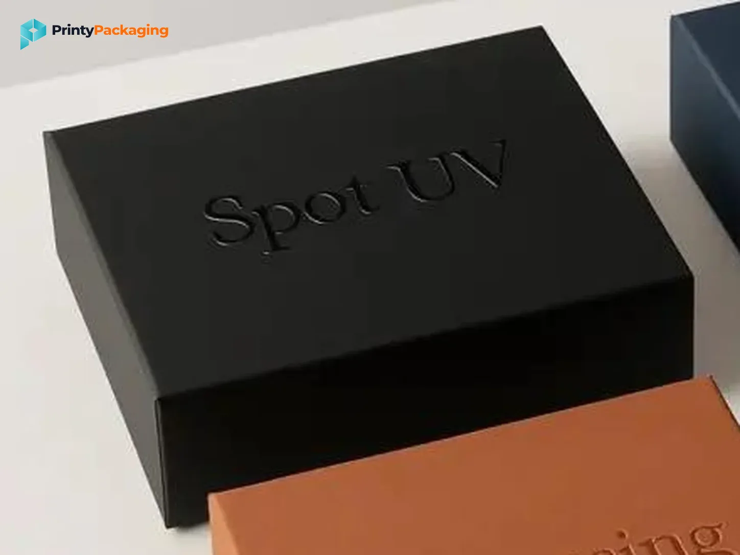 Black box with glossy spot UV lettering on a matte surface