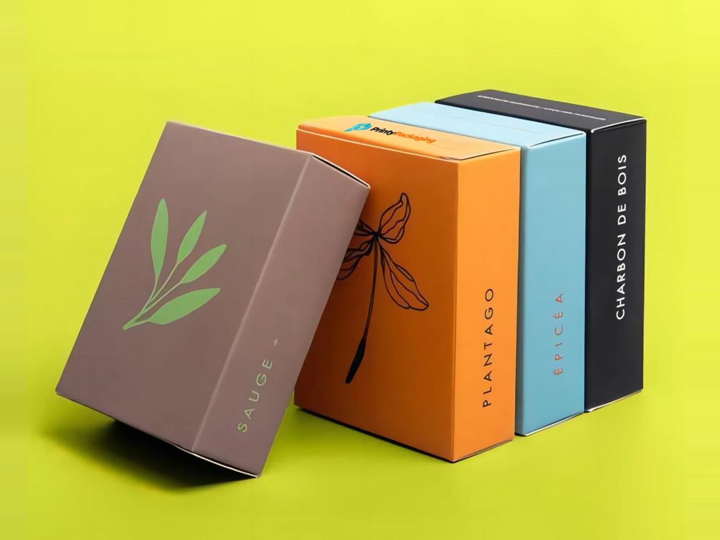 Four printed folding cartons in brown, orange, blue and black for a product line