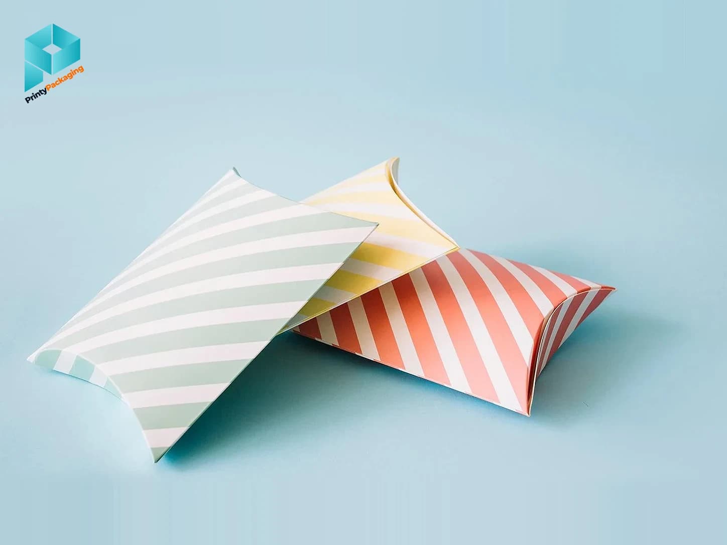 Striped pillow boxes on a light blue background