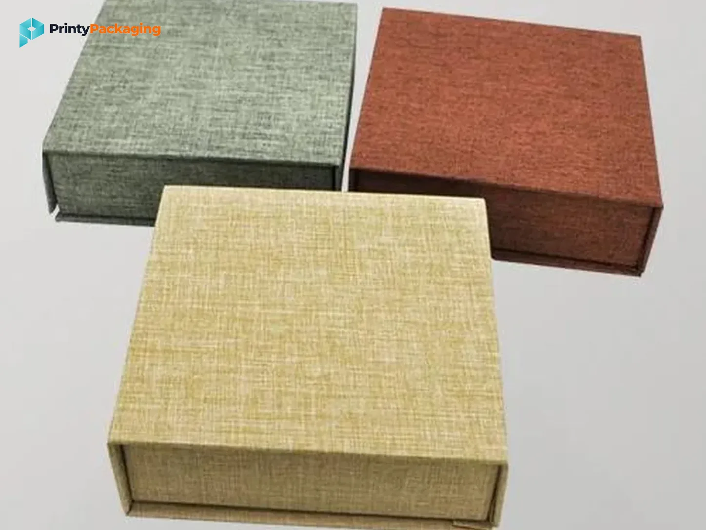 Rigid gift boxes wrapped in linen-textured paper