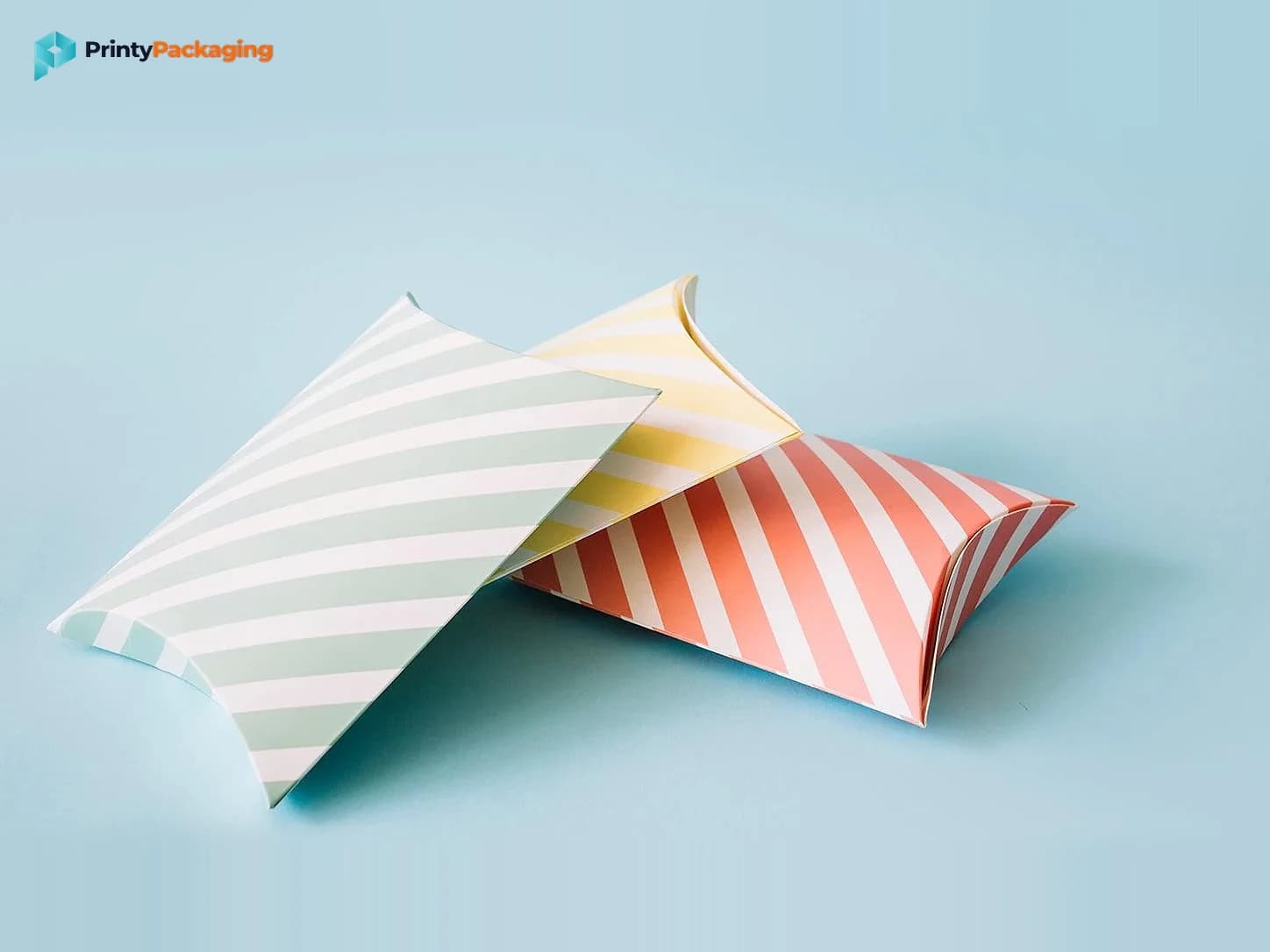 Striped pillow boxes on a light blue background